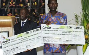 Cargill C&C - Yao N'Dri Pascal, farmer and co-op president (left) with a fellow farmer