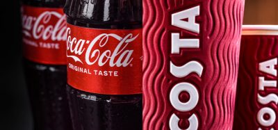 An image showing a stack of glass Coca-Cola bottles on the left, next to a stack of branded Costa Coffee cups on the right, representing the partnership between the two companies.
