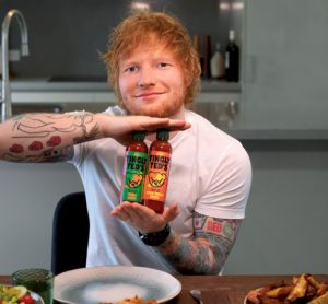 Ed Sheeran holding Tingly Ted's sauce