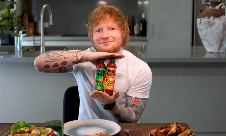 Ed Sheeran holding Tingly Ted's sauce