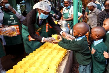 Food4Education giving out food to children