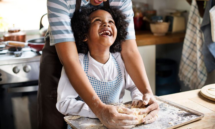 Child and mother with baking kit