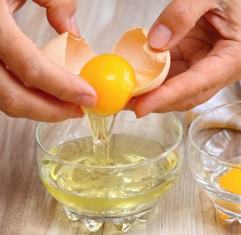 cracking eggs into bowl