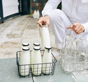 milkman loading up glass bottles