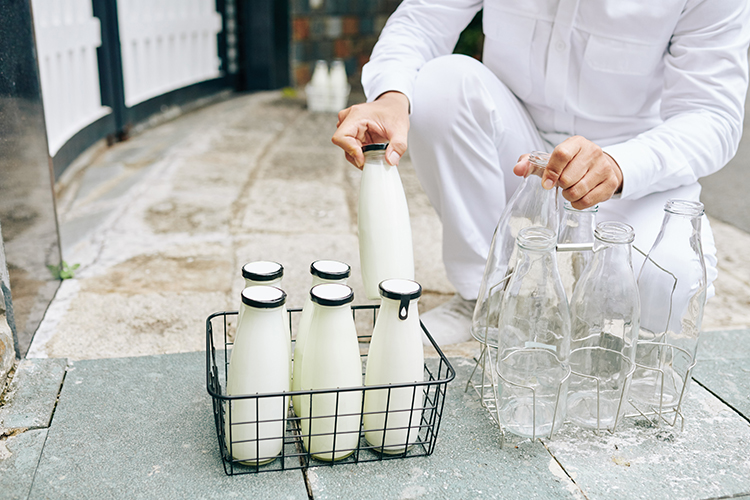 milkman loading up glass bottles