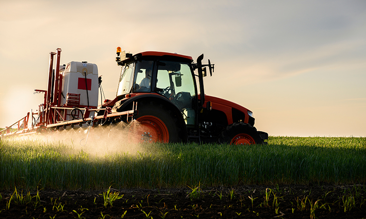 pesticides sprayed onto green fields