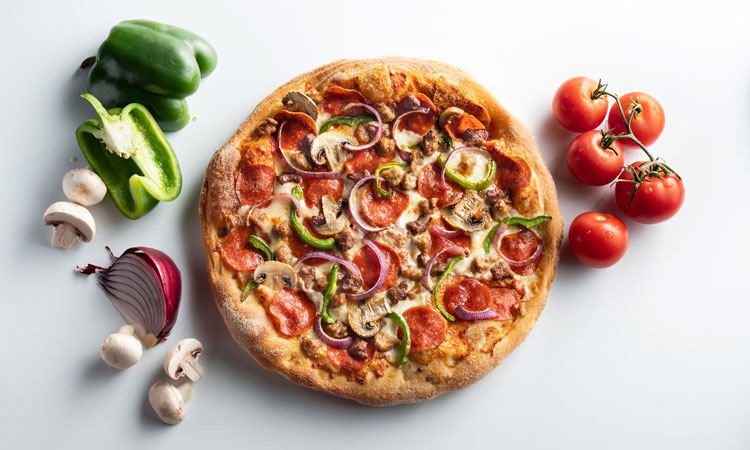 Why is the price of a pizza in the US higher than in Europe or