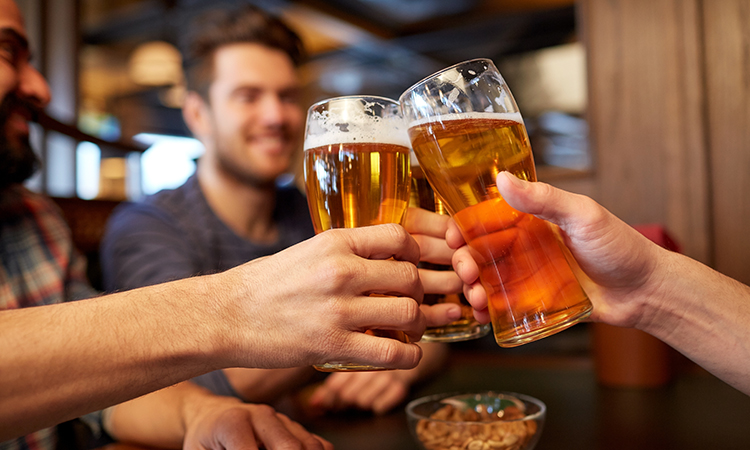 friends sharing a pint at the pub