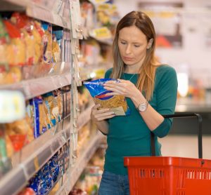 woman reading food label