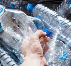 hand holding water bottle