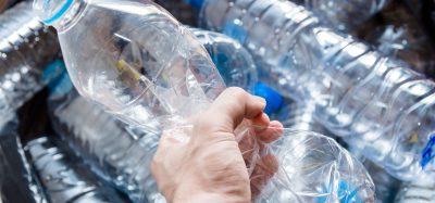 hand holding water bottle