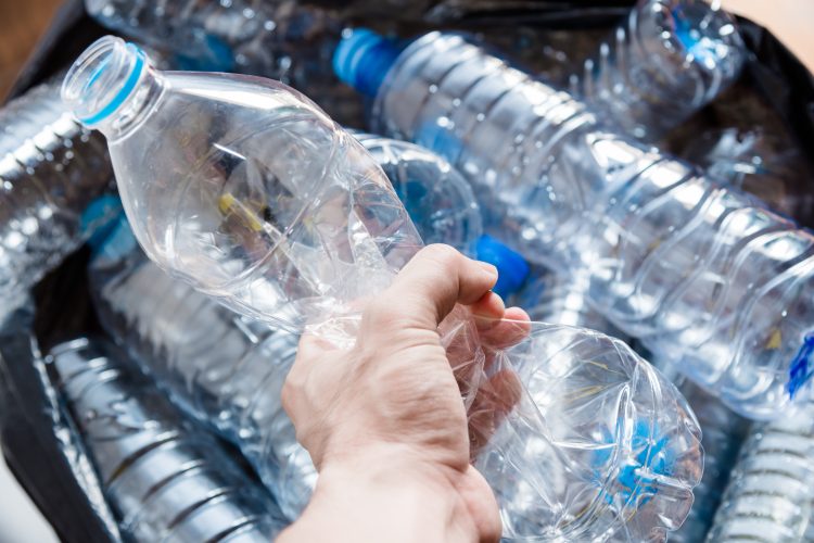 hand holding water bottle