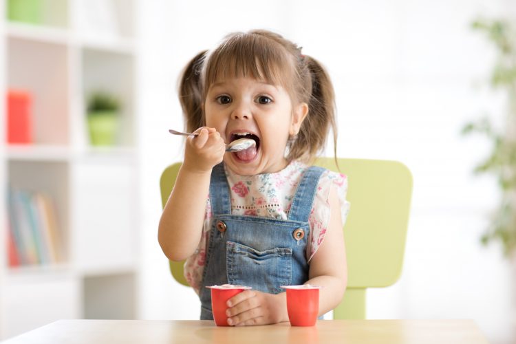 child eating yoghurt