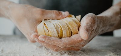 man making fresh pasta