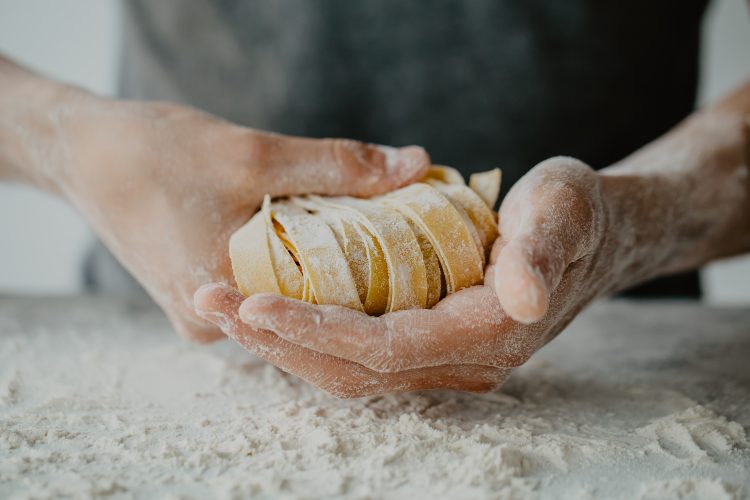 man making fresh pasta