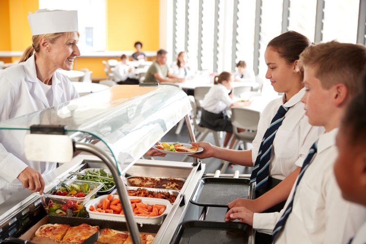 students getting school lunch