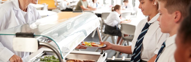 students getting school lunch