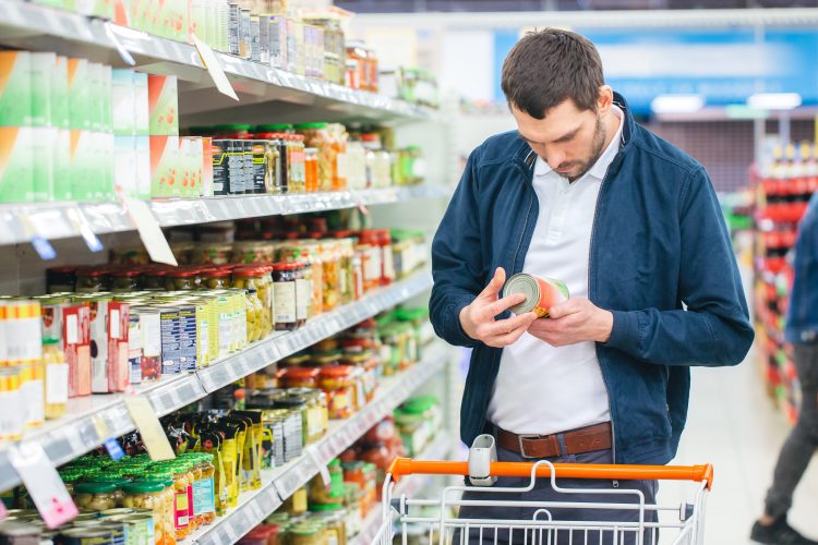 man holding canned food