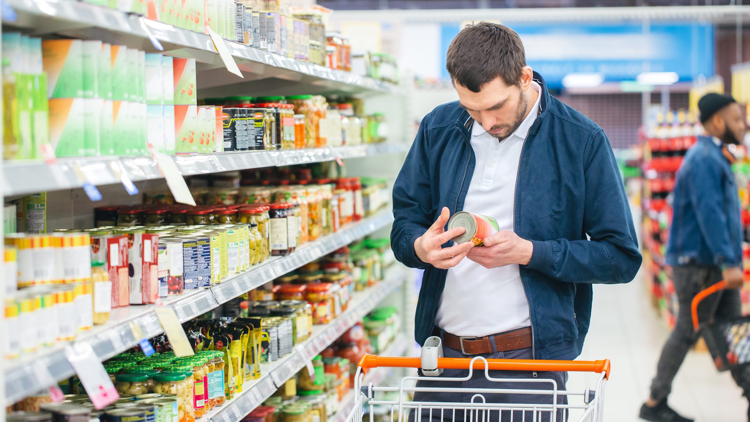 man holding canned food