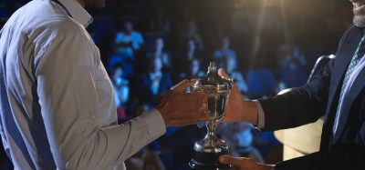 man getting award
