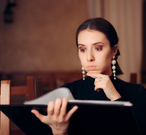 woman choosing from menu