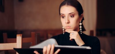 woman choosing from menu