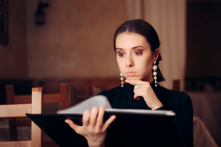 woman choosing from menu