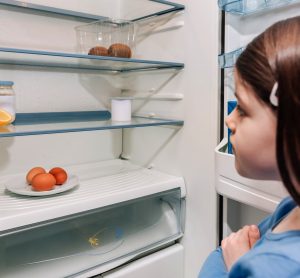 Child and fridge