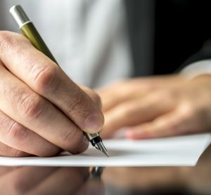 man writing letter