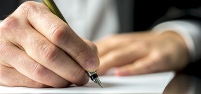 man writing letter