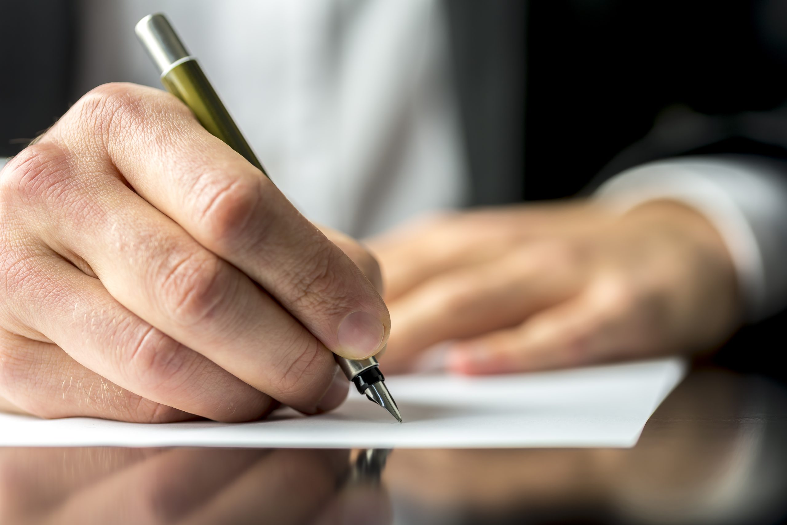 man writing letter