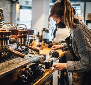 woman pouring coffee