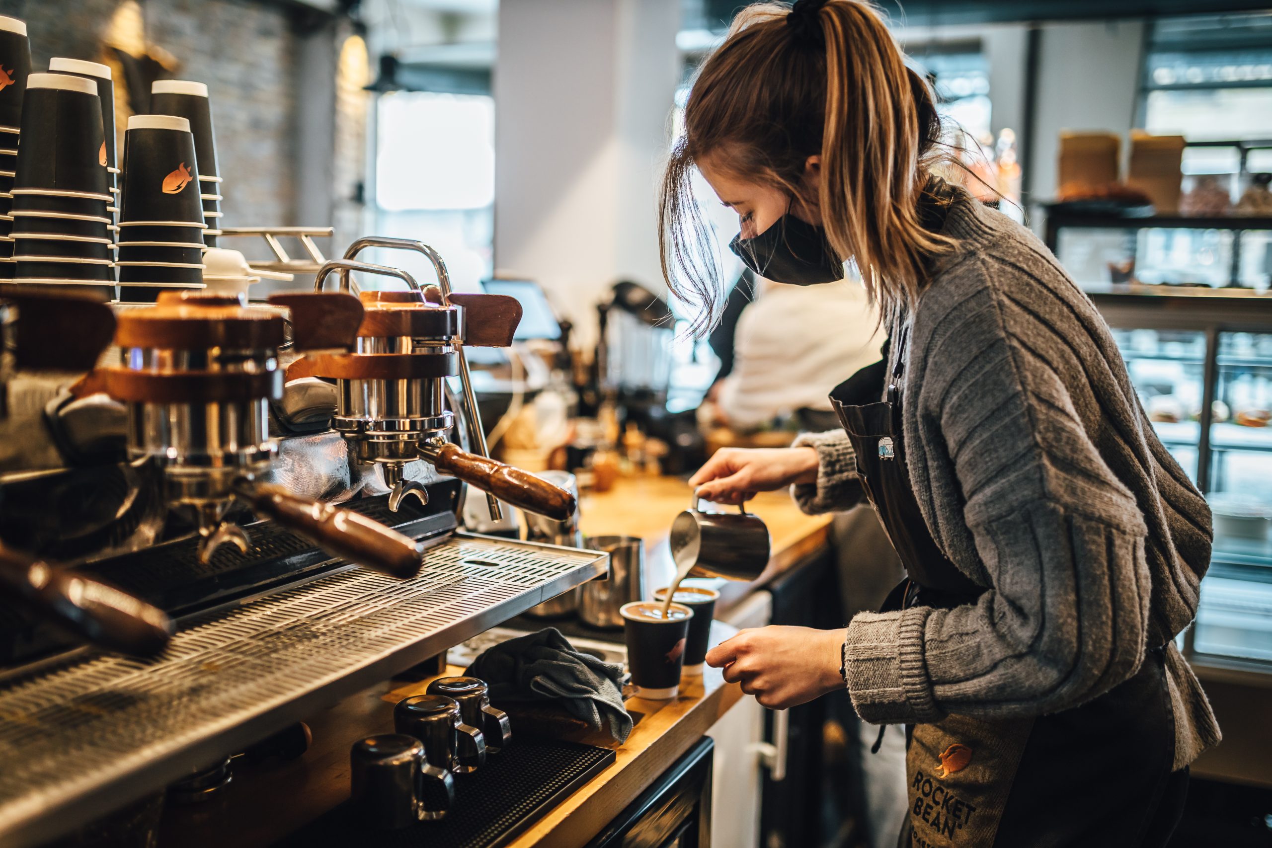 woman pouring coffee