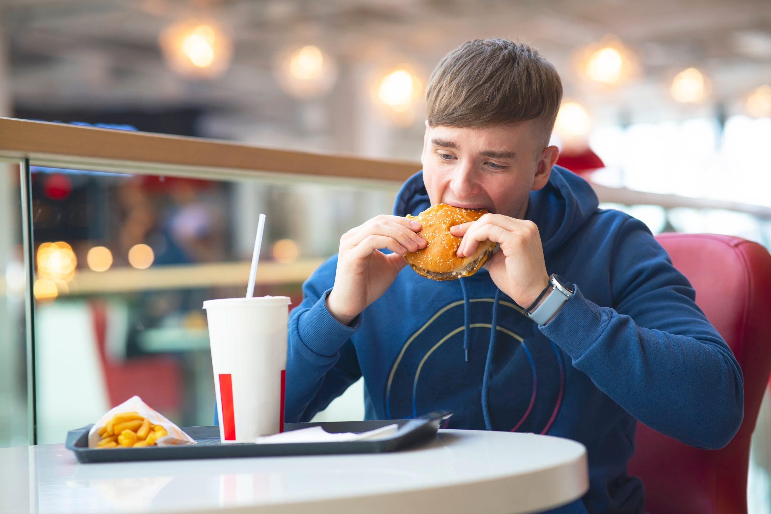 man eating burger