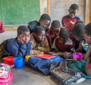 school children with packed lunch