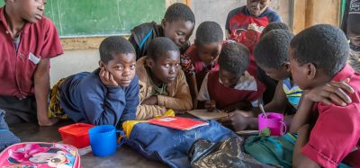 school children with packed lunch