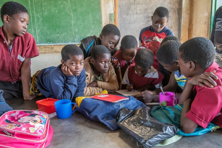 school children with packed lunch