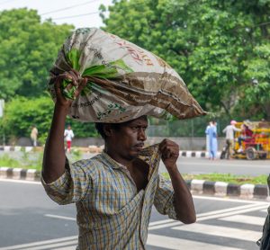 man carrying rice