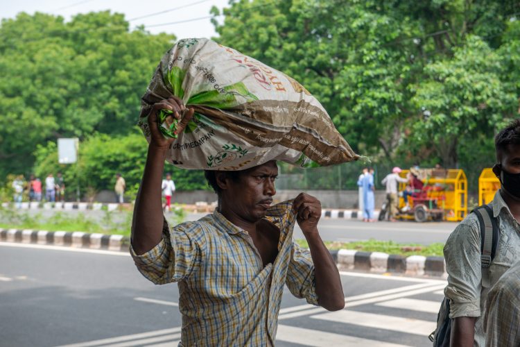 man carrying rice