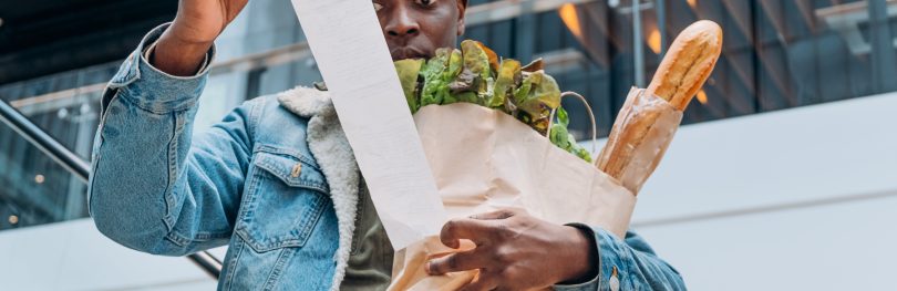 man reading receipt