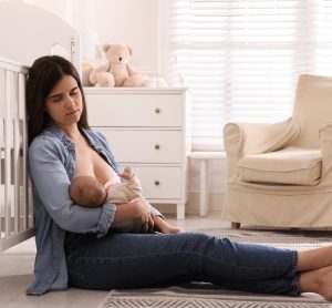 sad woman breastfeeding