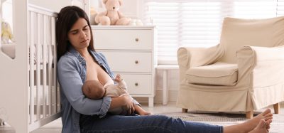 sad woman breastfeeding