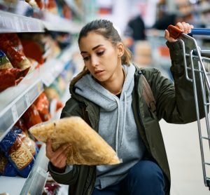 woman looking at pasta