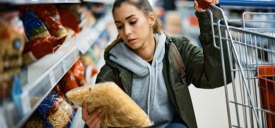 woman looking at pasta