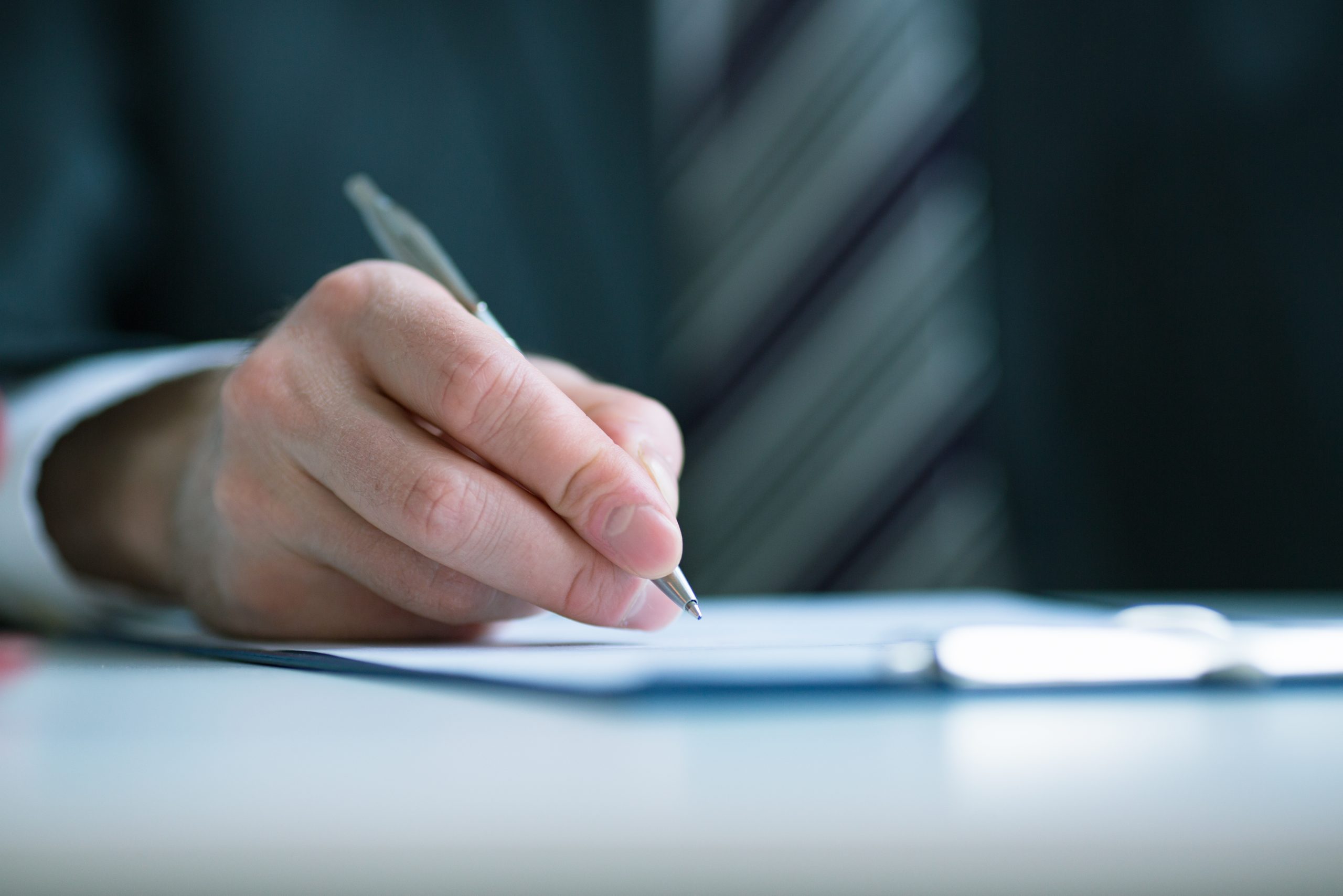 man writing letter