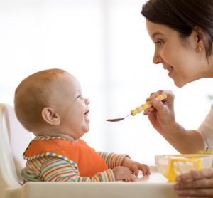 Mum feeding baby