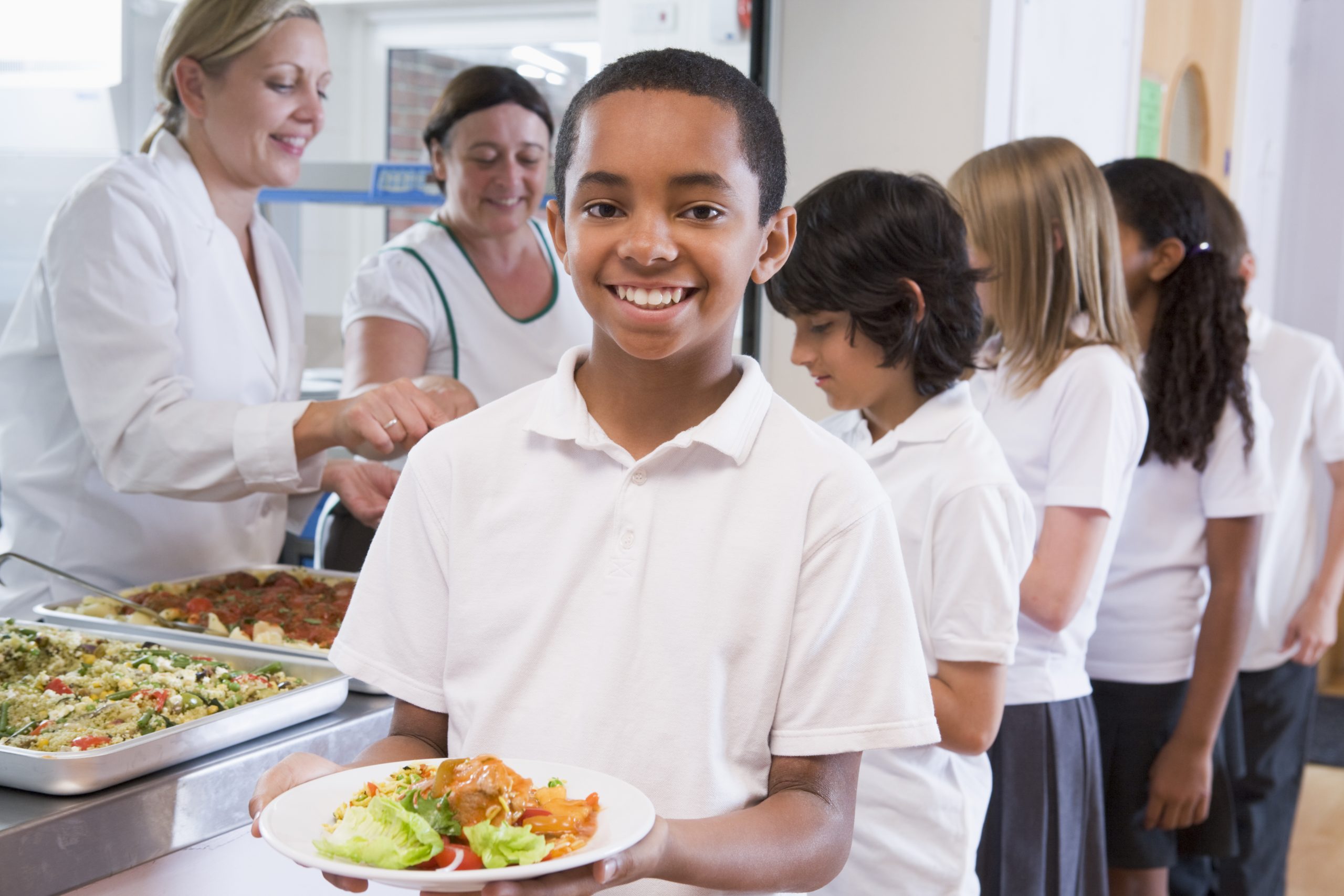 child holding school meal