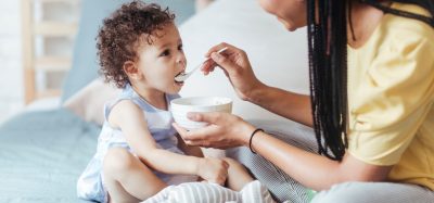 mum feeding toddler