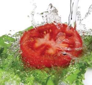 Washing a tomato