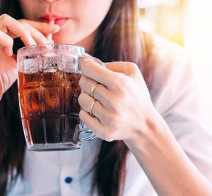 woman drinking cola